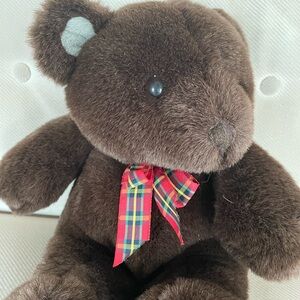 Chocolate brown bear with bow